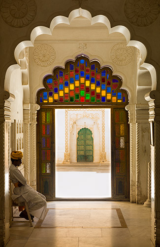 A magnificent fortress glows in the desert sun in Jodhpur. Within the Mehrangarh Fortress’s crenelated walls, beautifully ornate rooms like the above hall of public audience greeted visitors and travelers to the Rajah’s ornate home. A guard watches over the room, which like the fortress was built in 1459. 